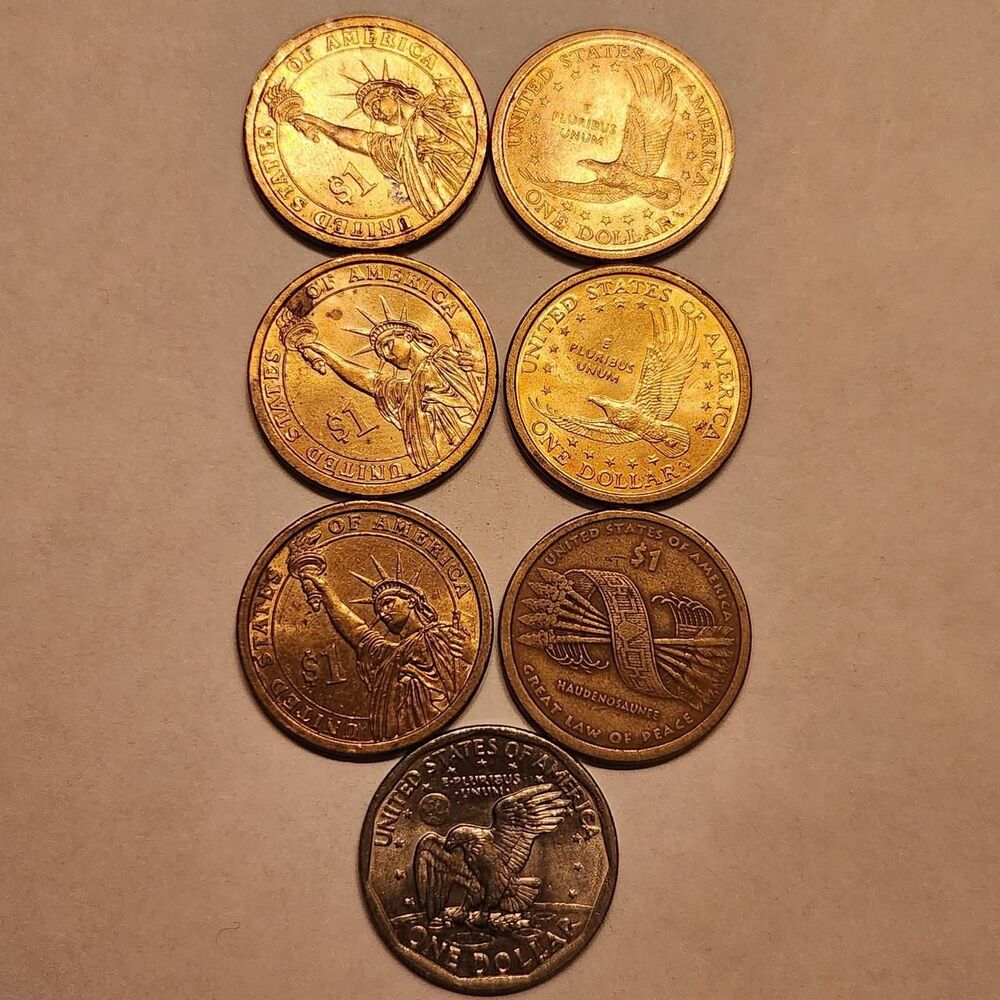 LOT OF SEVEN.
Nice Mix of 1Dollar coins. Start...